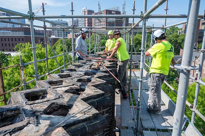 Dj Cross Technicians Working On Chimney