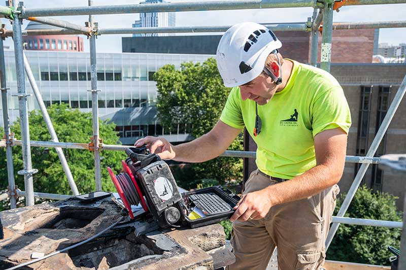 Technician Scanning Chimney Technician Scanning Chimney