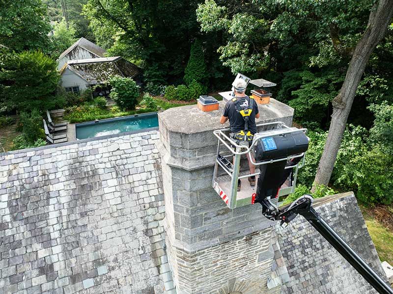 Technician Working On Chimney 1